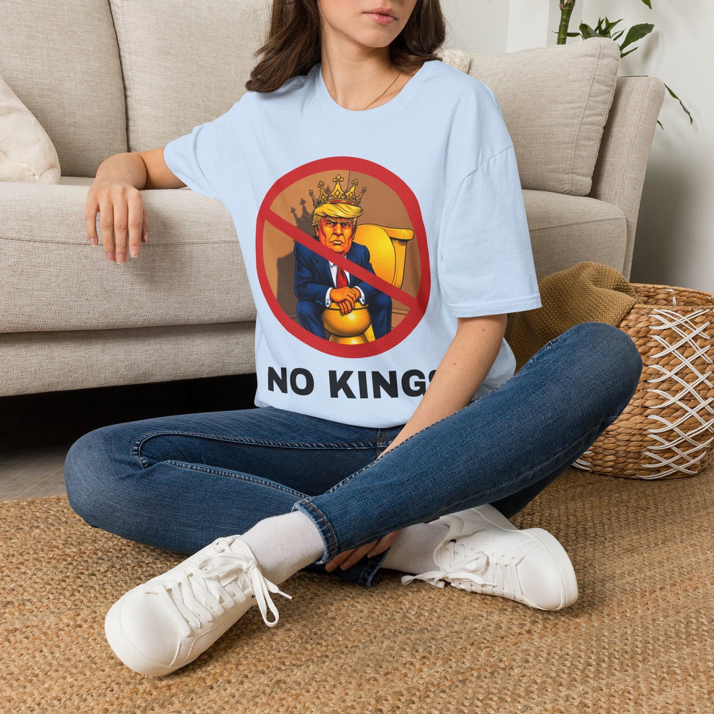 Model wearing a NO KINGS T-shirt in blue