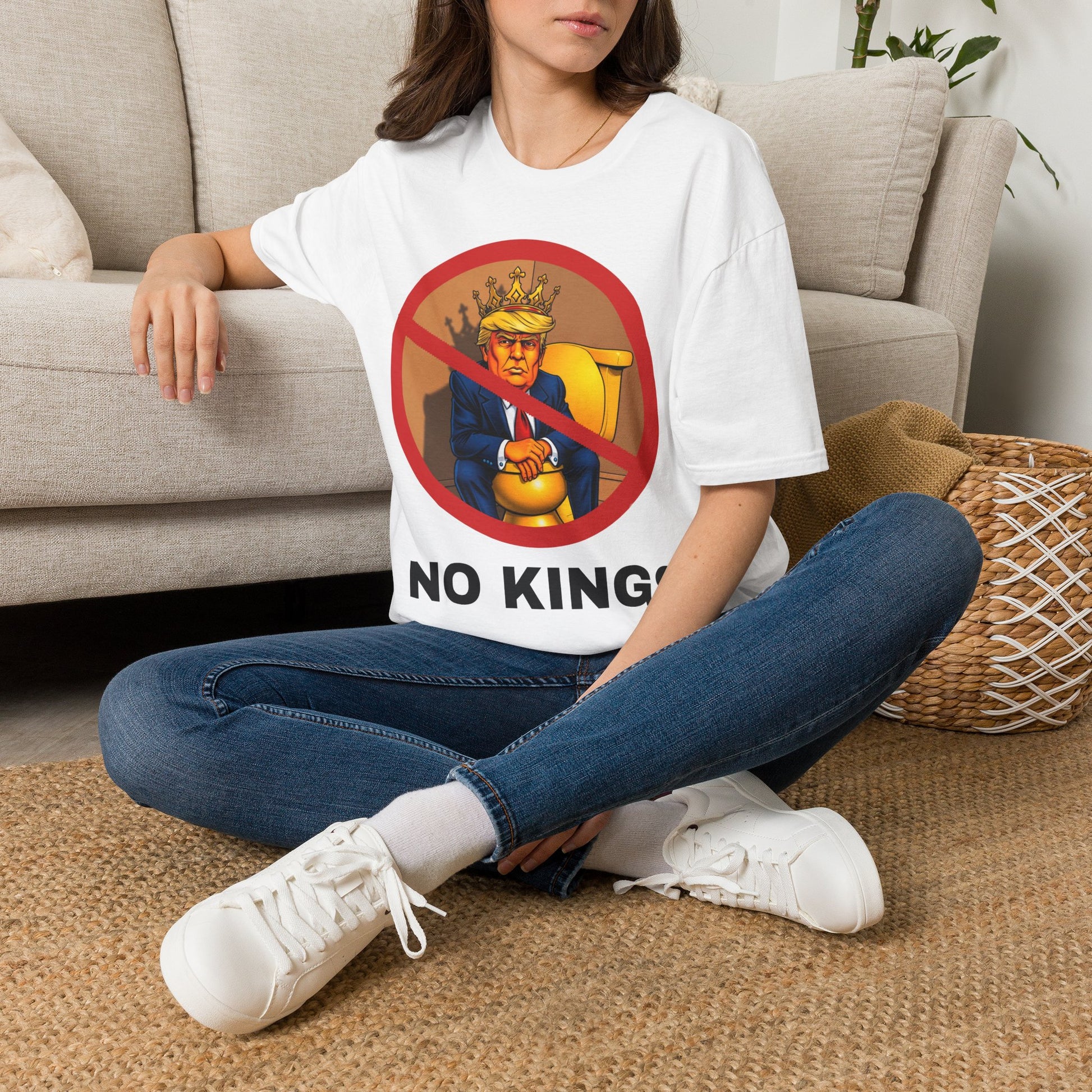Model wearing a NO KINGS T-shirt in white